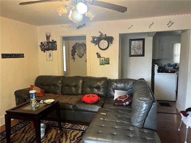 living room featuring ceiling fan and wood finished floors