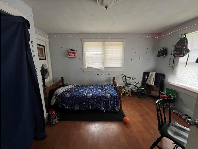 bedroom featuring wood finished floors