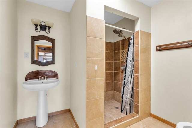 bathroom with toilet, walk in shower, and tile patterned floors