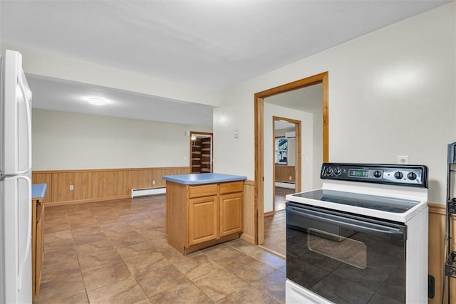 kitchen with white fridge, a baseboard heating unit, wood walls, and electric range oven