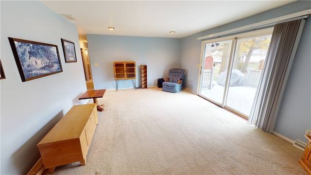 sitting room featuring carpet