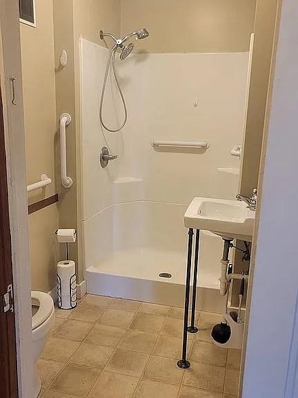 203 N E St, Olney, IL 62450 - bathroom with toilet and walk in shower
