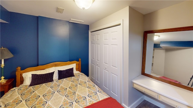 bedroom featuring a closet and baseboards