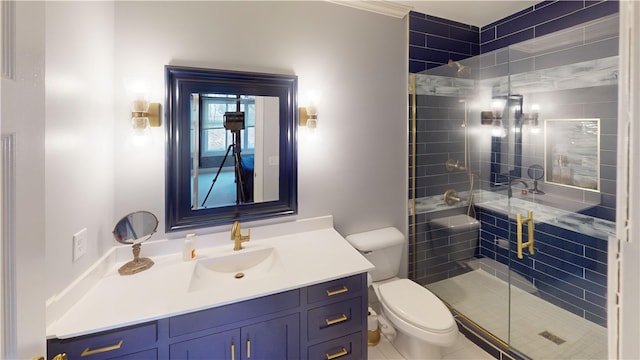 full bathroom with vanity, a shower stall, and toilet