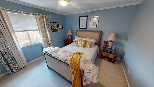 bedroom with a ceiling fan, light carpet, crown molding, and baseboards