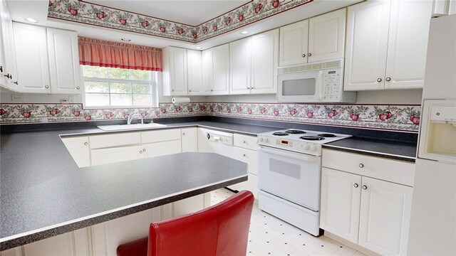 313 Shimp St, Cerro Gordo Township, IL 61855 - kitchen featuring white appliances, dark countertops, light floors, a sink, and white cabinetry