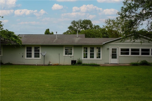 313 Shimp St, Cerro Gordo Township, IL 61855 - back of property featuring a yard, stucco siding, and a shingled roof