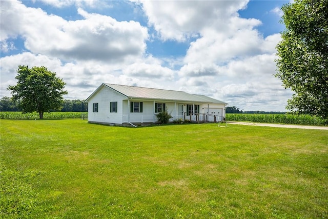 11444 N 800th St, Effingham, IL 62401 - view of front of home featuring an attached garage, a front yard, a metal roof, and a rural view