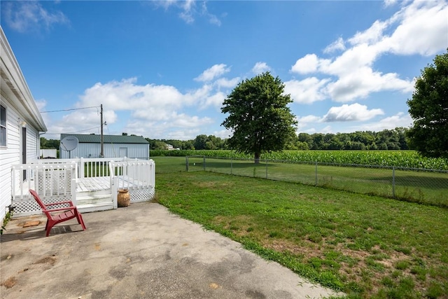 11444 N 800th St, Effingham, IL 62401 - fenced backyard with a view of countryside, a patio, a wooden deck, and agricultural area