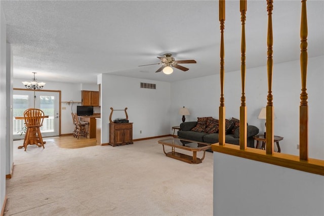 11444 N 800th St, Effingham, IL 62401 - living room with light carpet, a ceiling fan, and a chandelier