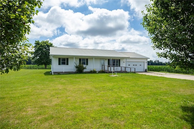 11444 N 800th St, Effingham, IL 62401 - view of front of home with driveway, a front lawn, an attached garage, and a metal roof