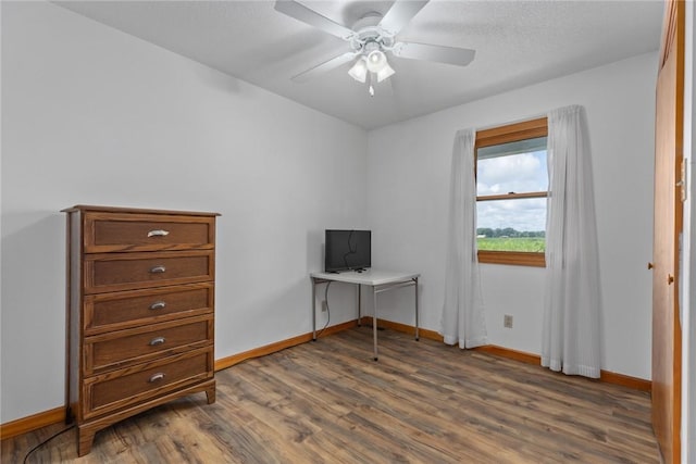 11444 N 800th St, Effingham, IL 62401 - bedroom with dark wood finished floors, an office area, and a ceiling fan