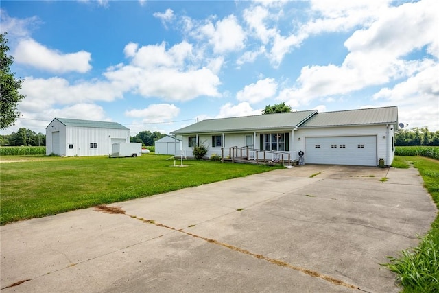 11444 N 800th St, Effingham, IL 62401 - single story home with an attached garage, a front yard, concrete driveway, a metal roof, and a porch