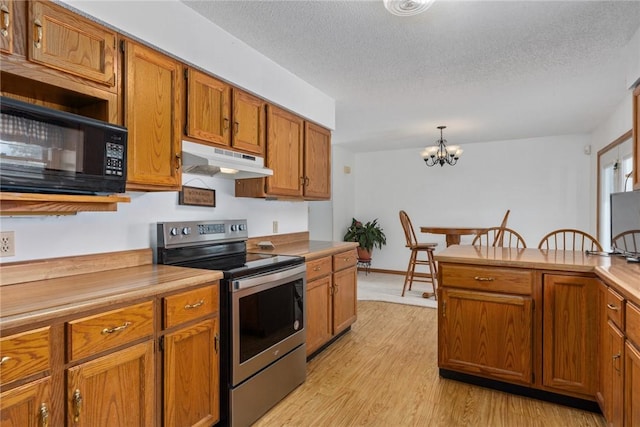 11444 N 800th St, Effingham, IL 62401 - kitchen featuring electric range, under cabinet range hood, black microwave, brown cabinets, and light wood-style floors