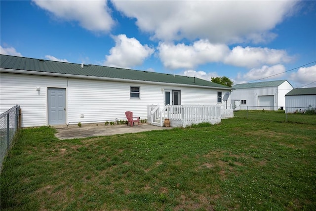 11444 N 800th St, Effingham, IL 62401 - back of house featuring a patio, a fenced backyard, a metal roof, and a deck