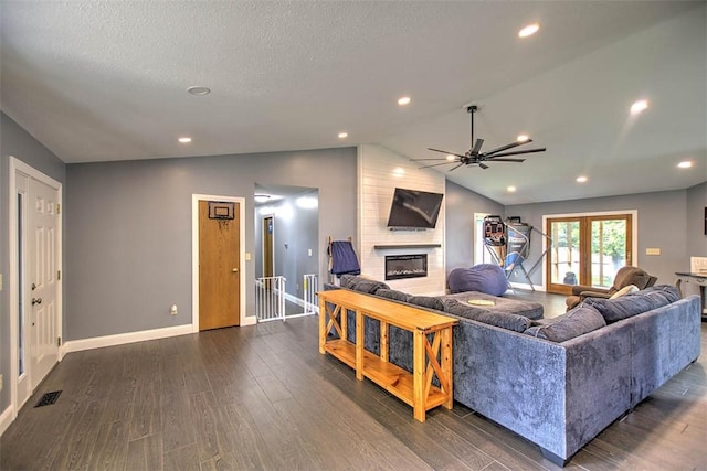 7950 Lehman Rd, Decatur, IL 62521 - living room featuring a large fireplace, ceiling fan, dark wood-type flooring, vaulted ceiling, and recessed lighting