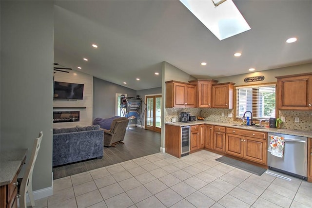 7950 Lehman Rd, Decatur, IL 62521 - kitchen featuring dishwasher, beverage cooler, open floor plan, plenty of natural light, and lofted ceiling