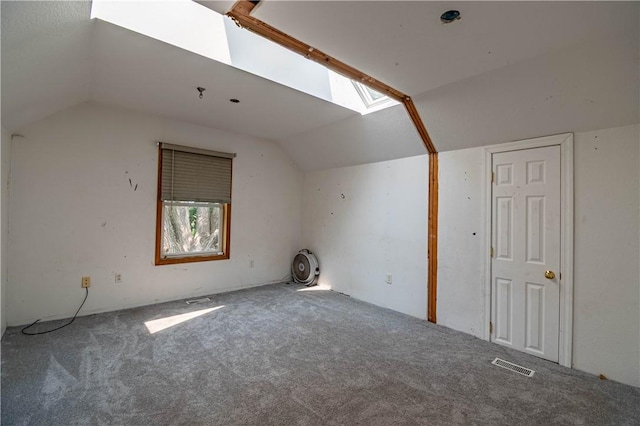 10622 N Rte 121, Latham, IL 62543 - additional living space featuring vaulted ceiling, carpet flooring, and a skylight