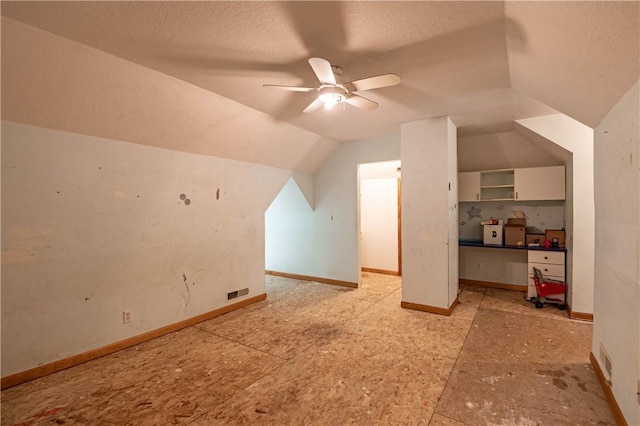 10622 N Rte 121, Latham, IL 62543 - bonus room with vaulted ceiling, ceiling fan, and a textured ceiling