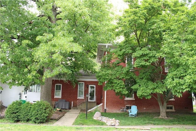 302 W N 3rd St, Shelbyville, IL 62565 - view of front facade with brick siding and a front lawn