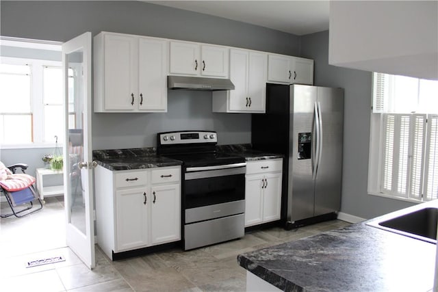 302 W N 3rd St, Shelbyville, IL 62565 - kitchen featuring appliances with stainless steel finishes, under cabinet range hood, white cabinetry, and dark countertops