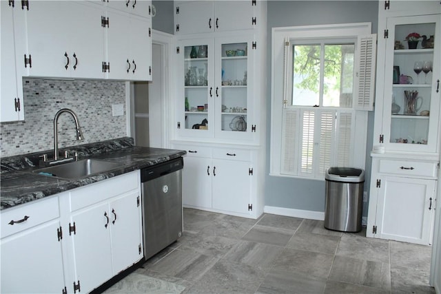 302 W N 3rd St, Shelbyville, IL 62565 - kitchen featuring stainless steel dishwasher, a sink, decorative backsplash, and white cabinets
