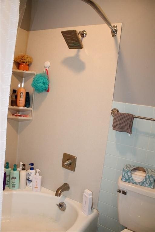 302 W N 3rd St, Shelbyville, IL 62565 - bathroom featuring toilet, shower / bath combo with shower curtain, and tile walls