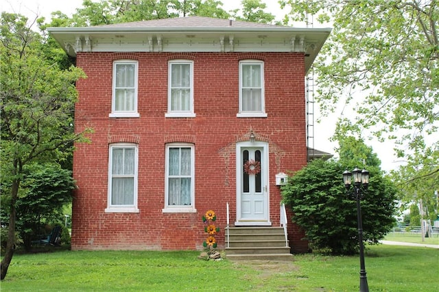 302 W N 3rd St, Shelbyville, IL 62565 - italianate home with entry steps, a front yard, and brick siding