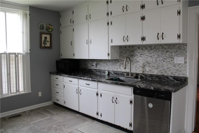 302 W N 3rd St, Shelbyville, IL 62565 - kitchen with stainless steel dishwasher, a sink, black microwave, and healthy amount of natural light