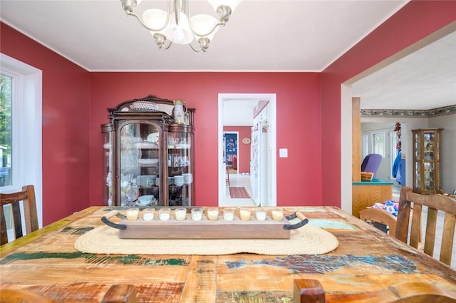 18 Woodmere Dr, Paris, IL 61944 - dining room with a chandelier and healthy amount of natural light