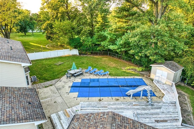 18 Woodmere Dr, Paris, IL 61944 - view of swimming pool featuring a patio area, a shed, and an outdoor structure
