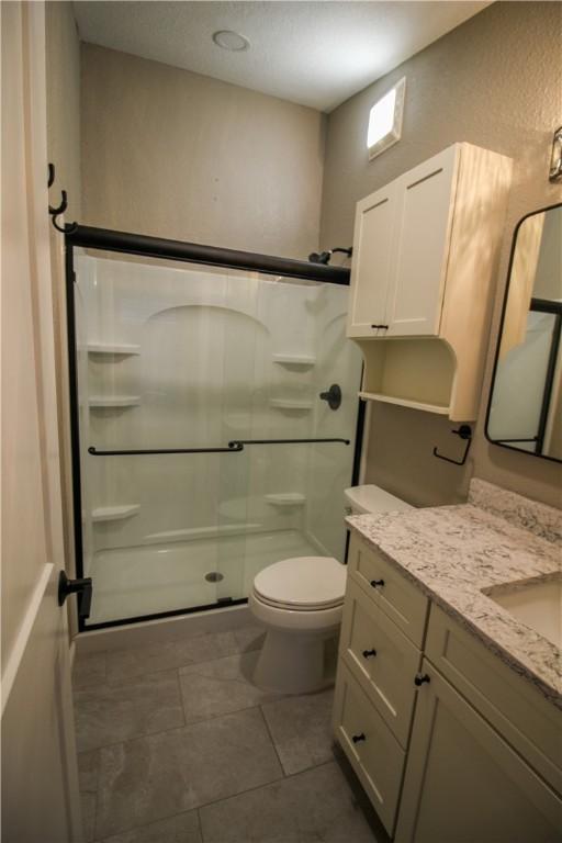 bedroom featuring hardwood / wood-style flooring, ceiling fan, and a closet