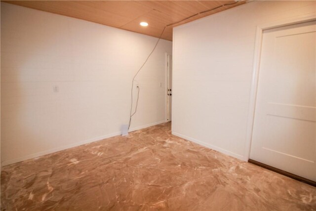 clothes washing area with dark wood-type flooring and stacked washer and dryer