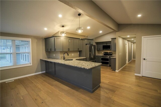 living room with lofted ceiling and hardwood / wood-style floors