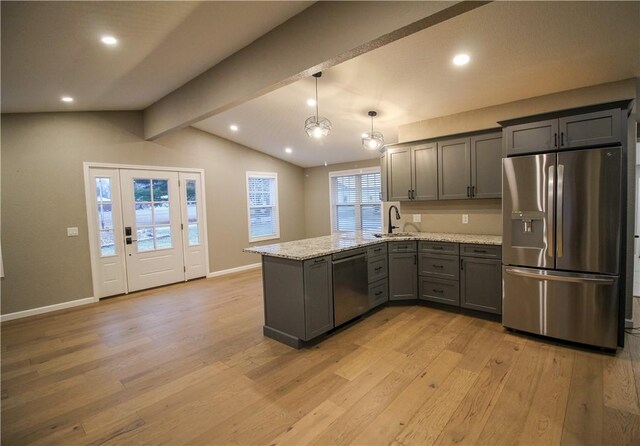 living room featuring hardwood / wood-style flooring and lofted ceiling