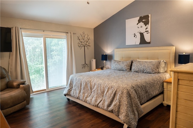 bedroom with access to exterior, lofted ceiling, and dark wood-type flooring