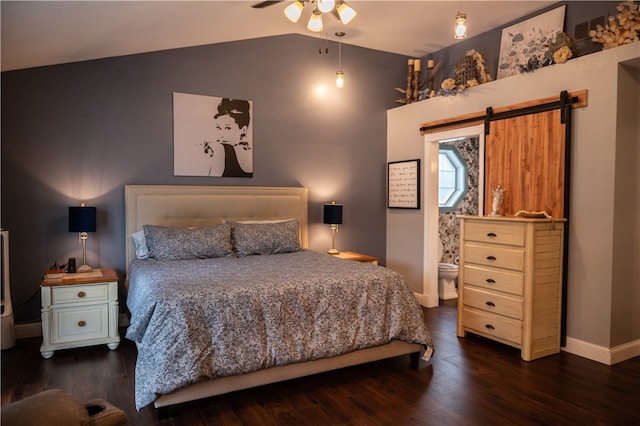 bedroom featuring a barn door, dark hardwood / wood-style floors, ceiling fan, and lofted ceiling