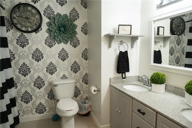 bathroom with tile patterned floors, vanity, and toilet