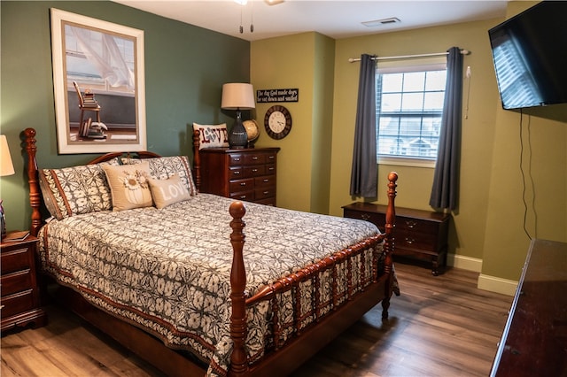 bedroom featuring dark hardwood / wood-style floors