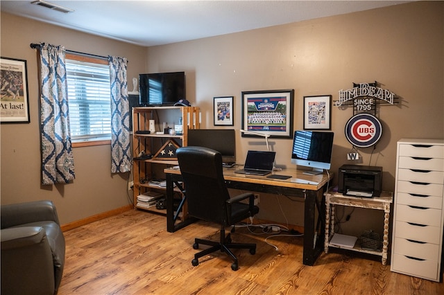 office area with light hardwood / wood-style flooring