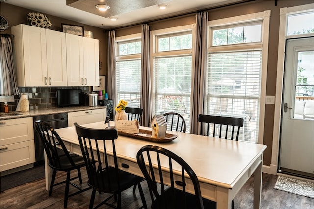 dining space with a textured ceiling, ceiling fan, and dark hardwood / wood-style floors