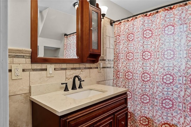 bathroom with tile walls and vanity