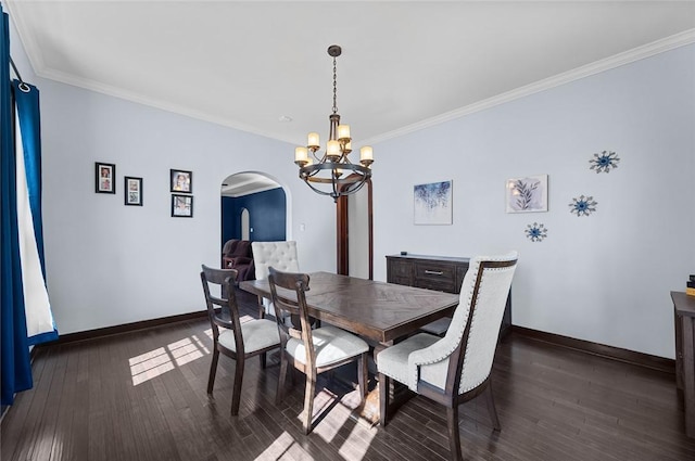 dining area with baseboards, arched walkways, a notable chandelier, and hardwood / wood-style flooring