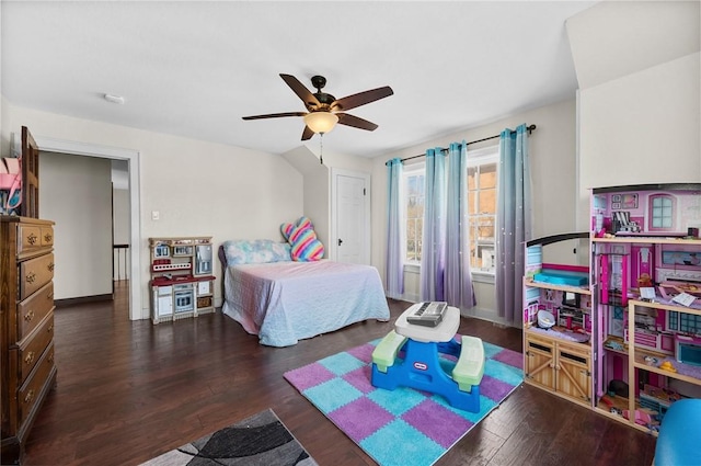 bedroom with a ceiling fan, wood finished floors, and baseboards