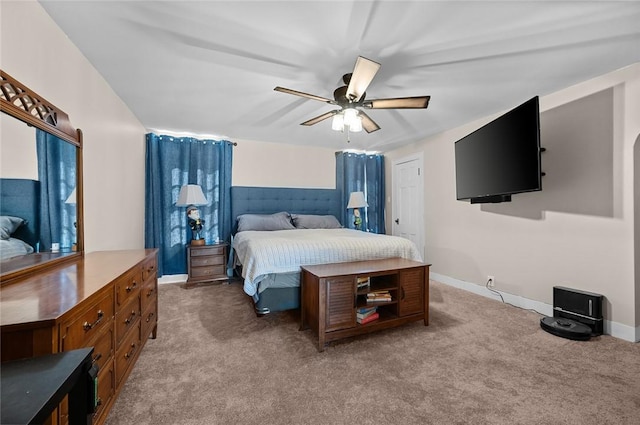bedroom featuring baseboards, ceiling fan, and carpet floors