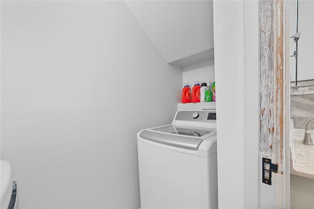 laundry room featuring washer / dryer and laundry area