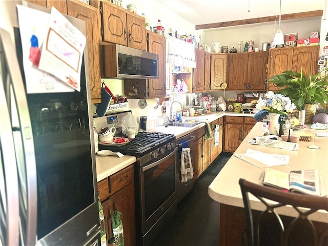 9275 N 890th St, Effingham, IL 62401 - kitchen with appliances with stainless steel finishes, light countertops, brown cabinets, and decorative light fixtures