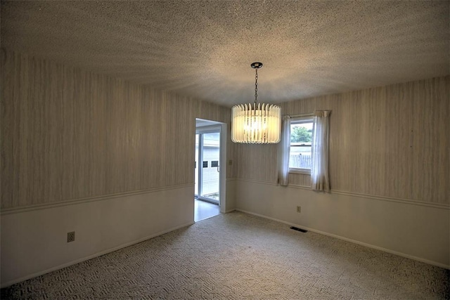 4324 Cleveland Ave, Decatur, IL 62521 - unfurnished dining area with a chandelier and carpet flooring