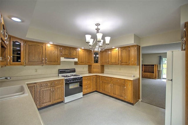 4324 Cleveland Ave, Decatur, IL 62521 - kitchen with white appliances, brown cabinetry, a chandelier, light countertops, and glass insert cabinets