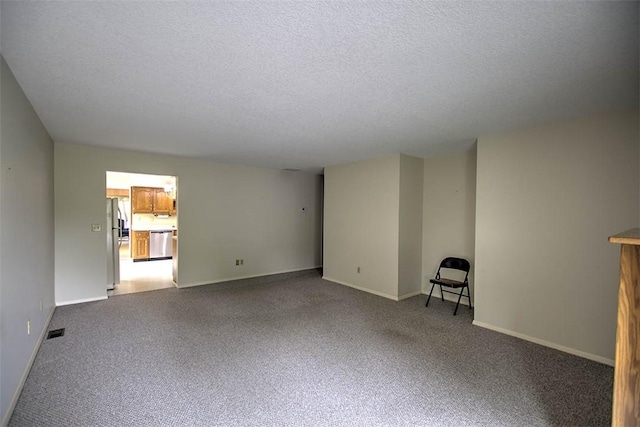 4324 Cleveland Ave, Decatur, IL 62521 - unfurnished living room featuring carpet floors and a textured ceiling